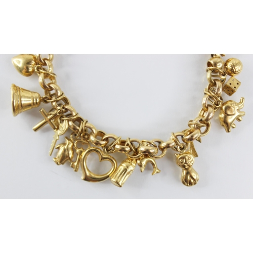 94 - A gold coloured charm bracelet, the belcher link chain with spring ring and loop fastening, suspendi... 