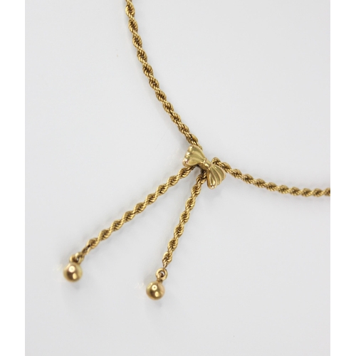 96 - A 9ct gold necklace, the rope twist chain with bow pendant suspending two beaded droppers, lobster c... 