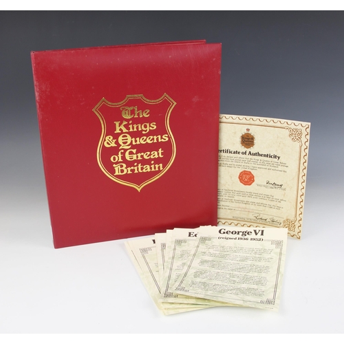 149 - An album of 23 carat gold with 12 carat white gold overlay faux stamps by Heirloom Investments, 