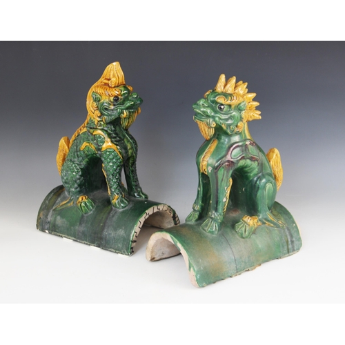 298 - A pair of Chinese Sancai glazed roof tiles, each modelled as a Kylin (Qilin), 34cm high (at fault)