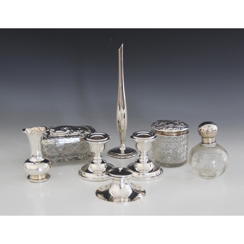 32 - A selection of silver mounted and silver coloured tableware, to include a silver mounted capstan ink... 