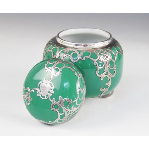 35 - A continental porcelain and silver plated overlaid tea caddy, modelled as a squat ginger jar with em... 