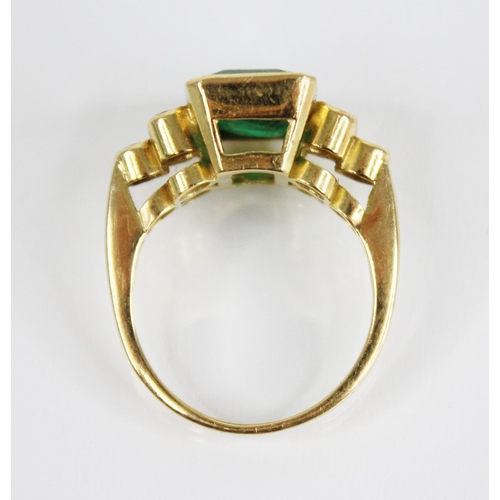 121 - An emerald and diamond 18ct gold ring, the central rectangular step cut emerald with canted corners ... 