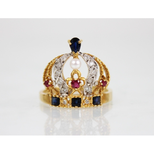 139 - An 18ct gold diamond, ruby, sapphire and pearl ring, modelled as a crown, the band set with step cut... 