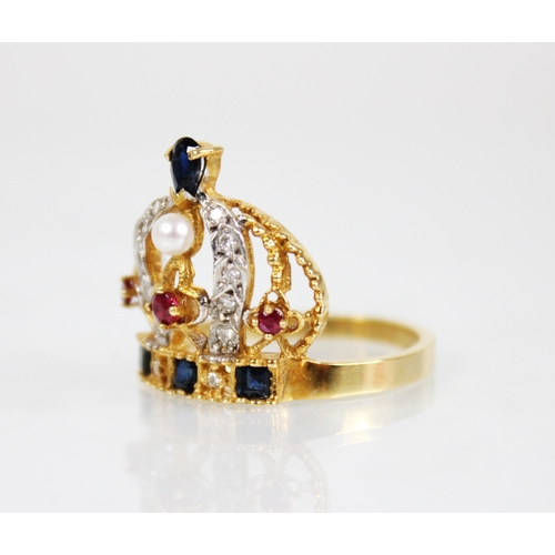 139 - An 18ct gold diamond, ruby, sapphire and pearl ring, modelled as a crown, the band set with step cut... 