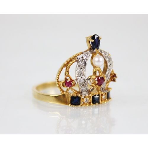 139 - An 18ct gold diamond, ruby, sapphire and pearl ring, modelled as a crown, the band set with step cut... 