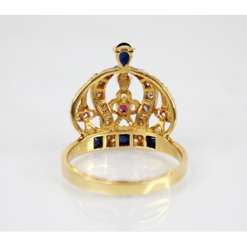 139 - An 18ct gold diamond, ruby, sapphire and pearl ring, modelled as a crown, the band set with step cut... 