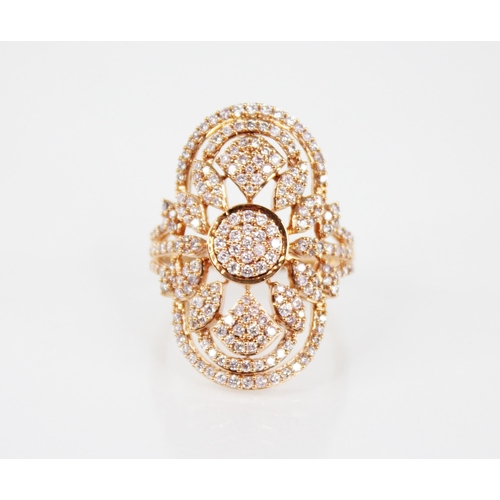 142 - A diamond and 18ct rose gold ring, the oval shaped head with pierced foliate detail, milgrain set wi... 