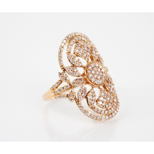 142 - A diamond and 18ct rose gold ring, the oval shaped head with pierced foliate detail, milgrain set wi... 