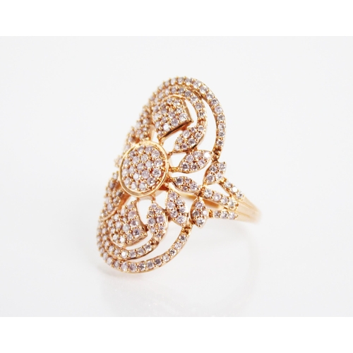 142 - A diamond and 18ct rose gold ring, the oval shaped head with pierced foliate detail, milgrain set wi... 