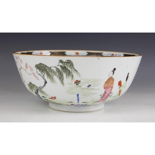 294 - A Chinese porcelain bowl, 18th century, decorated in a famille vert palette depicting figures seated... 