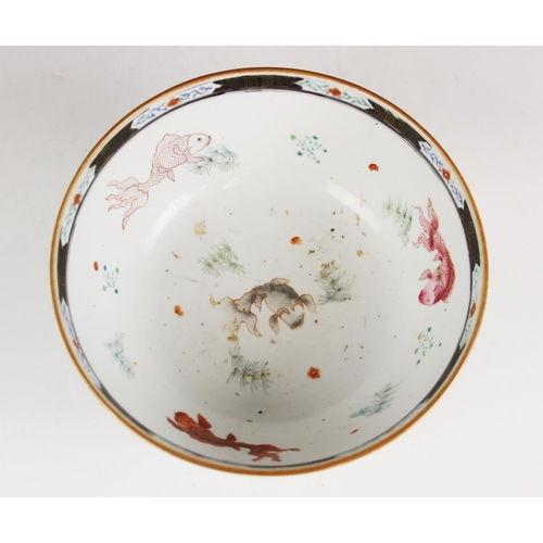 294 - A Chinese porcelain bowl, 18th century, decorated in a famille vert palette depicting figures seated... 