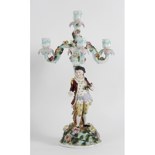 385 - A pair of continental porcelain five branch figural candelabra, late 19th century, one modelled with... 