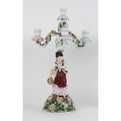 385 - A pair of continental porcelain five branch figural candelabra, late 19th century, one modelled with... 