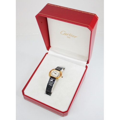 56 - A lady's Cartier Ellipse 18ct gold wristwatch, white dial with Roman numerals and inner seconds trac... 