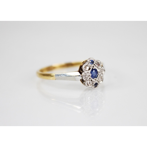 70 - An early 20th century sapphire and diamond 18ct gold and platinum ring, designed as a central oval m... 