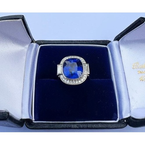 133 - An Art Deco Revival sapphire and diamond ring, the central cushion cut blue sapphire measuring appro... 