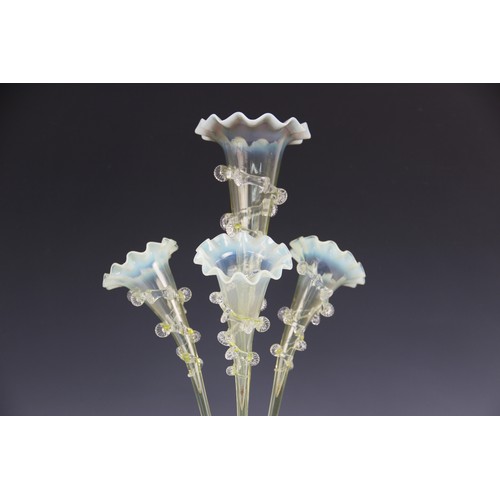 412 - A late 19th century vaseline glass epergne, with four crimped glass trumpet shaped vases, above a ce... 