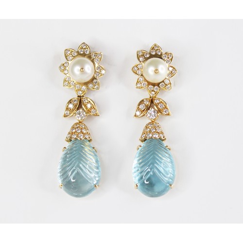 63 - A pair of blue topaz, pearl and diamond set 18ct gold drop earrings, each designed as a round cultur... 