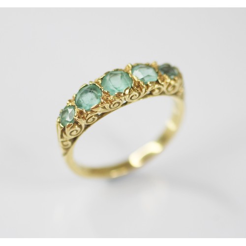 82 - A Victorian style five stone ring, comprising five graduated round mixed cut blue-green gemstones (p... 