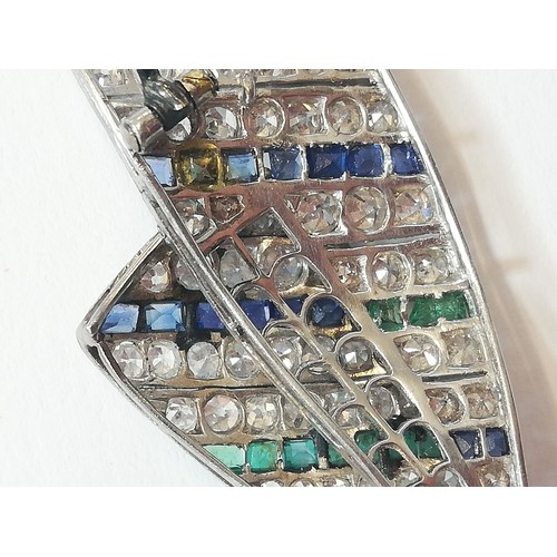 97 - An Art Deco diamond, sapphire and emerald bow brooch, the central round old cut diamond weighing app... 