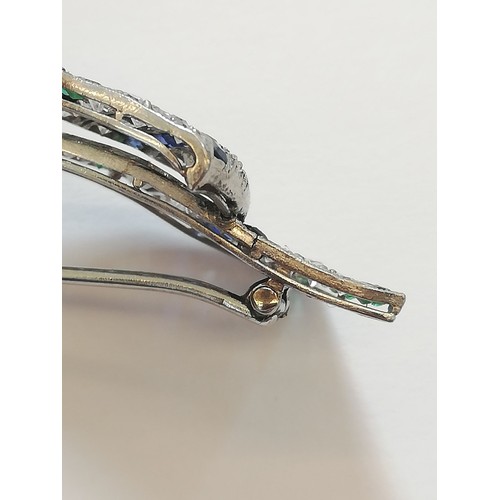 97 - An Art Deco diamond, sapphire and emerald bow brooch, the central round old cut diamond weighing app... 