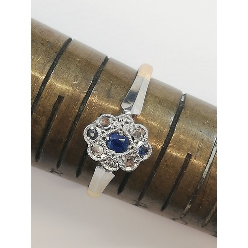 70 - An early 20th century sapphire and diamond 18ct gold and platinum ring, designed as a central oval m... 