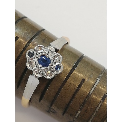 70 - An early 20th century sapphire and diamond 18ct gold and platinum ring, designed as a central oval m... 