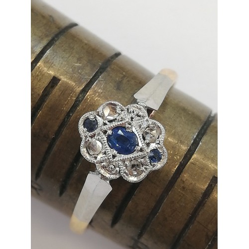 70 - An early 20th century sapphire and diamond 18ct gold and platinum ring, designed as a central oval m... 