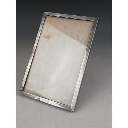 4 - A silver mounted photograph frame, Carr's of Sheffield Ltd, Sheffield 1998, of rectangular form with... 