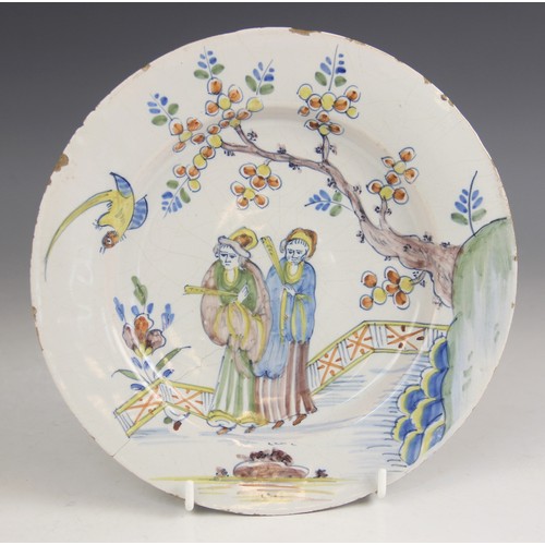 377 - An 18th century Delft tin-glazed earthenware plate, in the Fazackerley colour palette, decorated wit... 