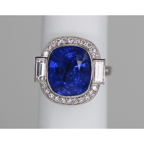 133 - An Art Deco Revival sapphire and diamond ring, the central cushion cut blue sapphire measuring appro... 