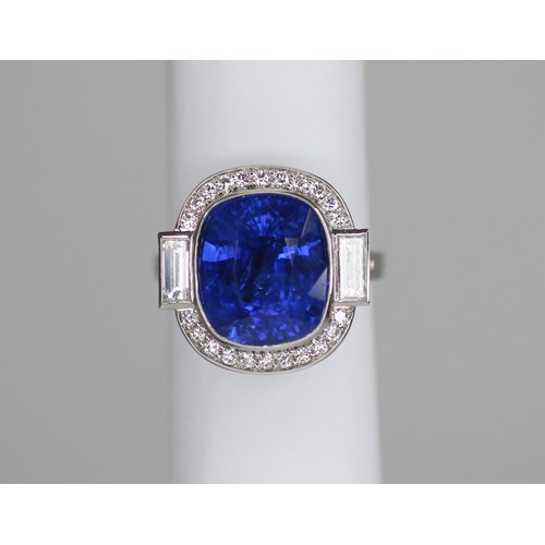 133 - An Art Deco Revival sapphire and diamond ring, the central cushion cut blue sapphire measuring appro... 