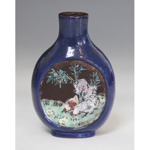 305 - A Chinese blue-ground Yixing stoneware snuff bottle, 19th century, decorated with two reserves depic... 