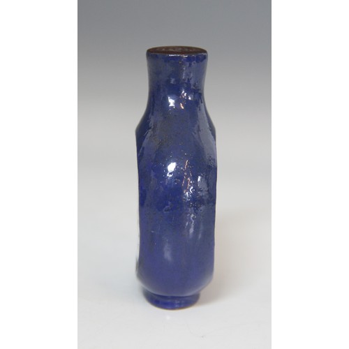 305 - A Chinese blue-ground Yixing stoneware snuff bottle, 19th century, decorated with two reserves depic... 