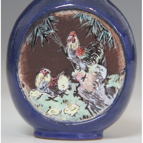 305 - A Chinese blue-ground Yixing stoneware snuff bottle, 19th century, decorated with two reserves depic... 