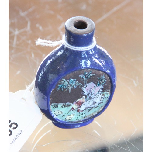 305 - A Chinese blue-ground Yixing stoneware snuff bottle, 19th century, decorated with two reserves depic... 