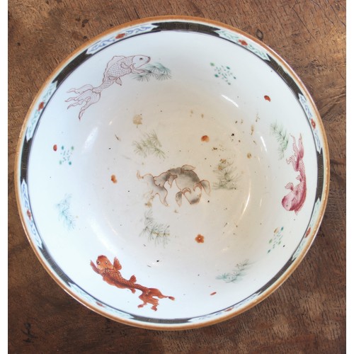 294 - A Chinese porcelain bowl, 18th century, decorated in a famille vert palette depicting figures seated... 