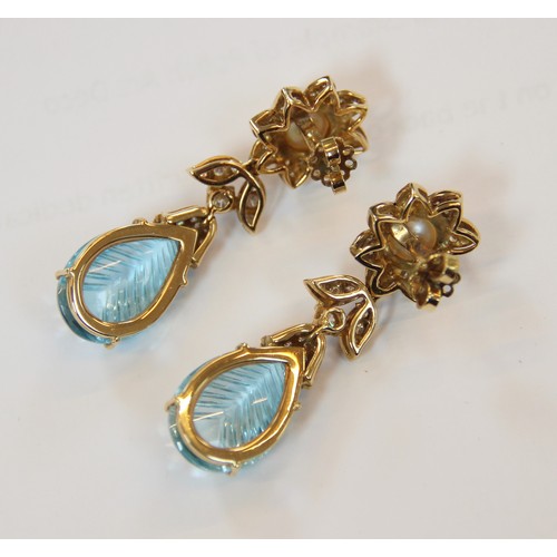 63 - A pair of blue topaz, pearl and diamond set 18ct gold drop earrings, each designed as a round cultur... 