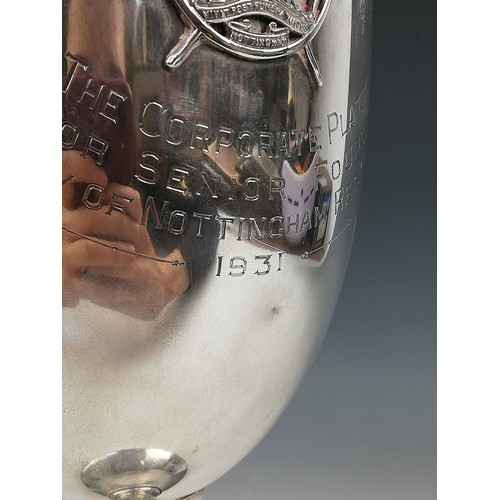 12 - A George V silver trophy cup, William Neale & Son Ltd, Birmingham 1931, of plain polished tapered fo... 