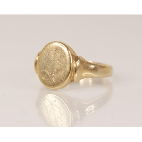 114 - A 9ct gold signet ring, the central oval head measuring 13mm x 11mm, engraved with monogrammed initi... 