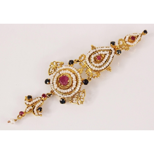 128 - An Indian pearl, ruby and sapphire articulated brooch pin, the gold coloured mount designed as two t... 