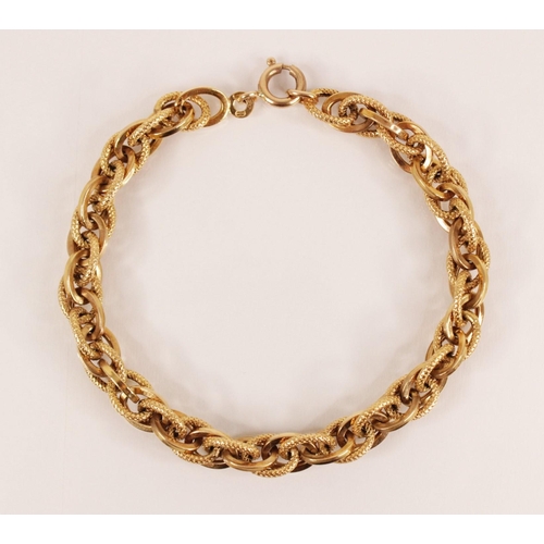 134 - An Italian 9ct gold bracelet by Unoaerre, comprising mixed plain polished and textured oval links, s... 