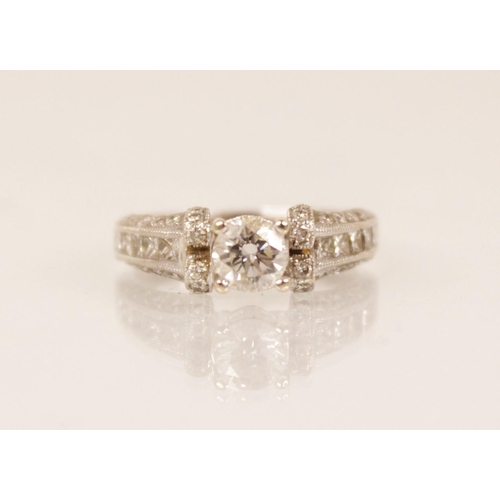 139 - A diamond 18ct white gold ring, the central round brilliant cut diamond weighing approximately 0.50 ... 