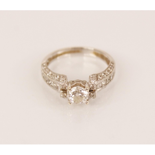 139 - A diamond 18ct white gold ring, the central round brilliant cut diamond weighing approximately 0.50 ... 