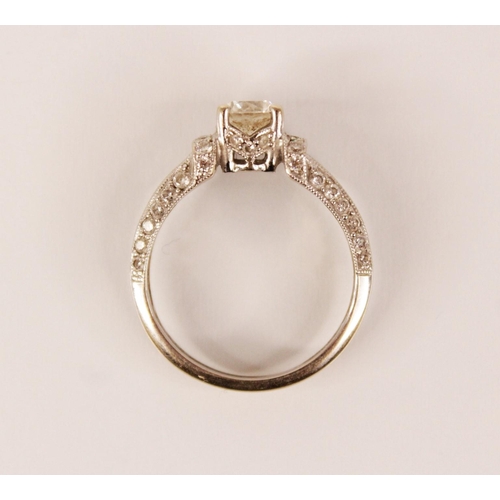 139 - A diamond 18ct white gold ring, the central round brilliant cut diamond weighing approximately 0.50 ... 