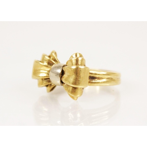 156 - A continental 18ct gold ring, the head modelled in yellow and white gold, 17.6mm x 12.2mm, set to 18... 