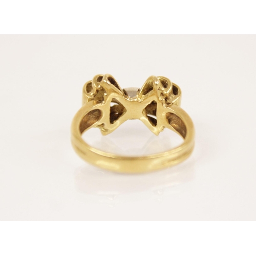 156 - A continental 18ct gold ring, the head modelled in yellow and white gold, 17.6mm x 12.2mm, set to 18... 