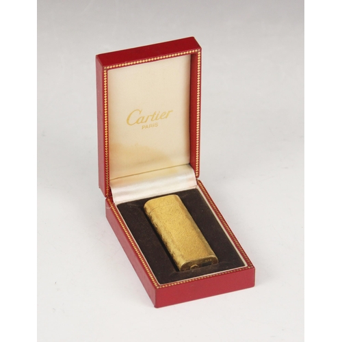 172 - A Cartier gold plated lighter, the body with brush textured finish, numbered 50535A, 7cm high, compl... 