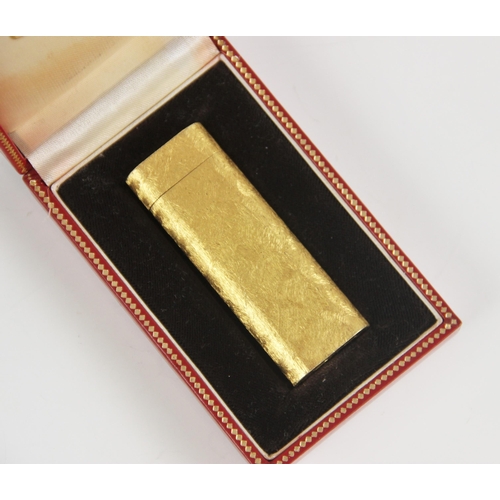 172 - A Cartier gold plated lighter, the body with brush textured finish, numbered 50535A, 7cm high, compl... 